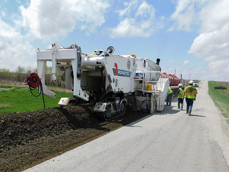 Coughlin Company performing Cold In-Place Recycling on a countryside road.
