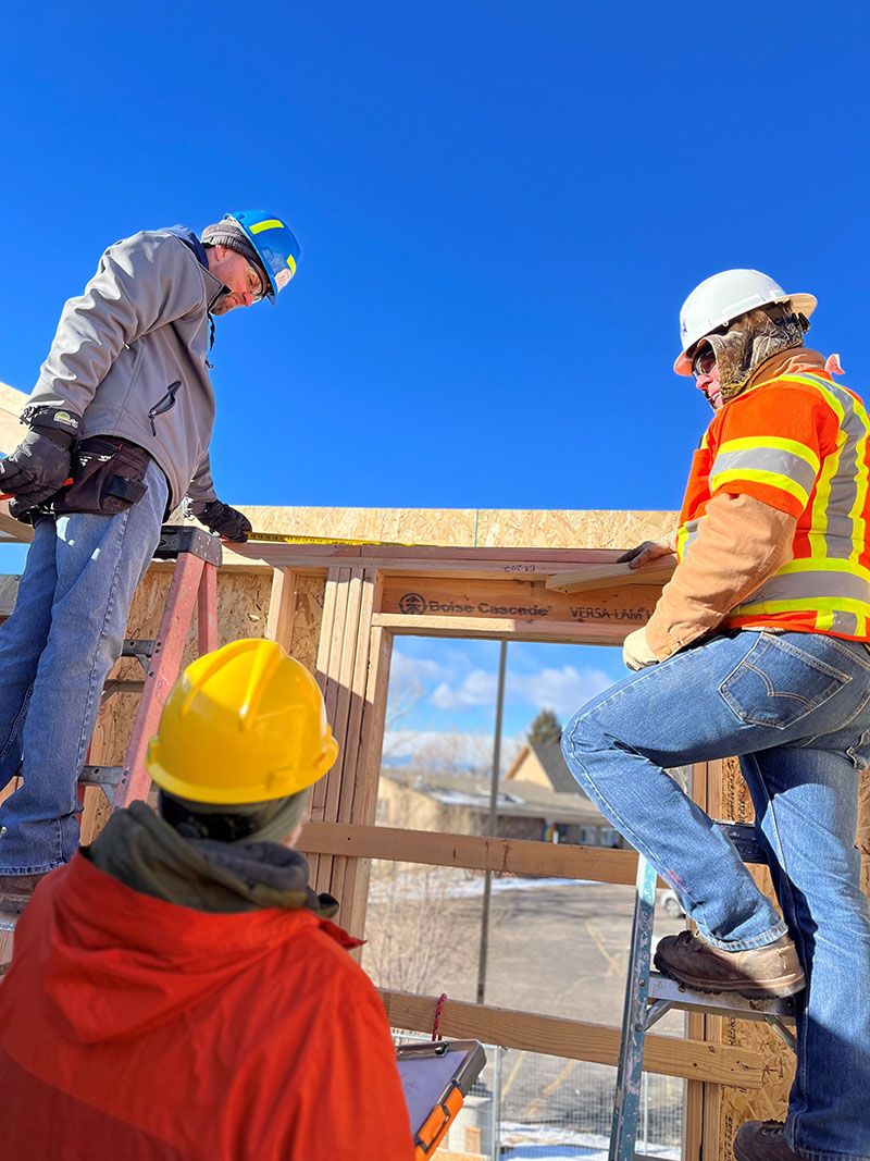 SurfaceCycle employees receive guidance from Habitat for Humanity at the Mountain View development site in Denver, CO.